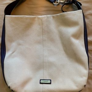 Coach handbag. Canvas outside, purple on the inside.